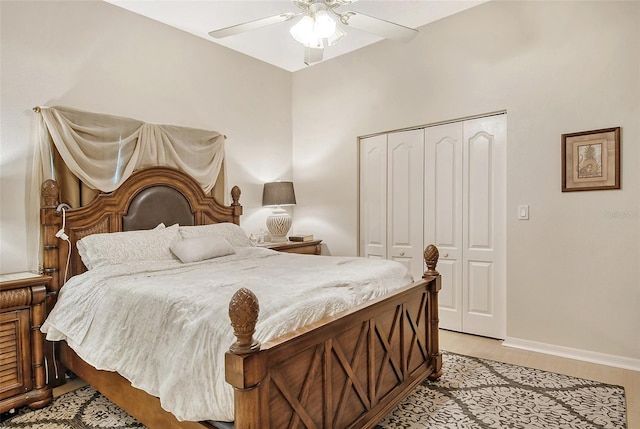 bedroom featuring ceiling fan, light hardwood / wood-style floors, and a closet