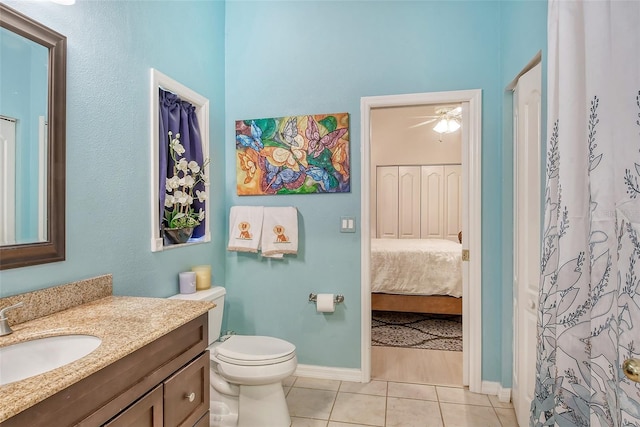 bathroom featuring tile patterned floors, toilet, vanity, and ceiling fan