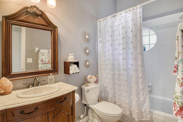 full bathroom featuring shower / tub combo with curtain, vanity, and toilet