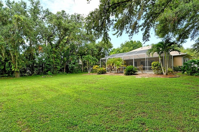 view of yard featuring glass enclosure