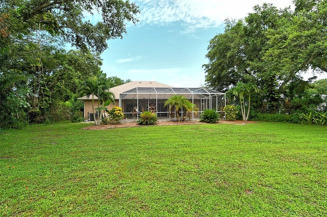 view of yard featuring glass enclosure