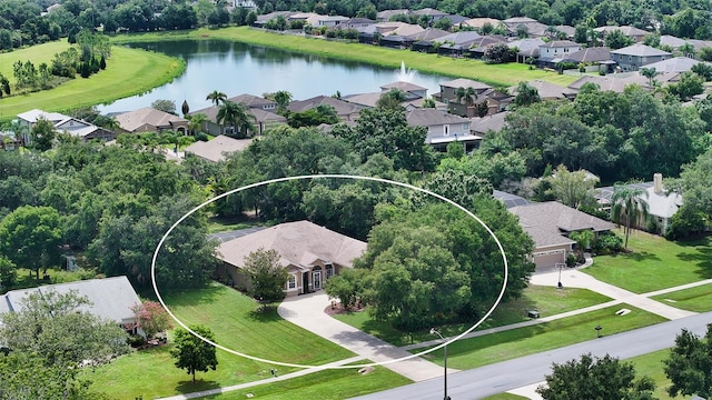 birds eye view of property with a water view