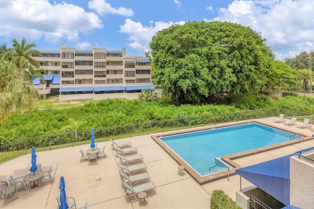 view of swimming pool featuring a patio area