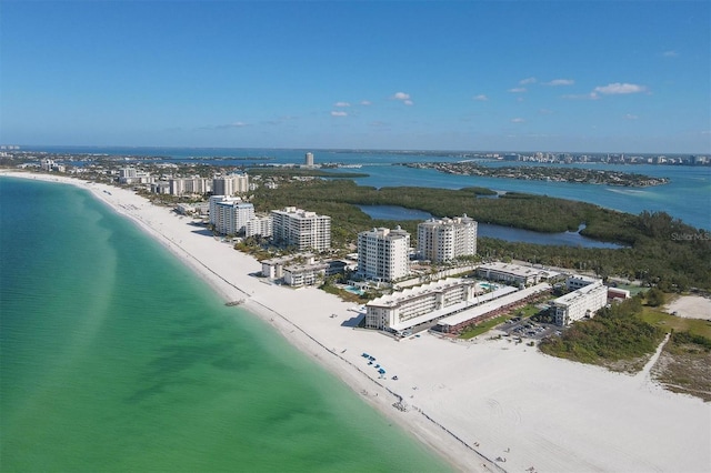 bird's eye view with a water view and a view of the beach