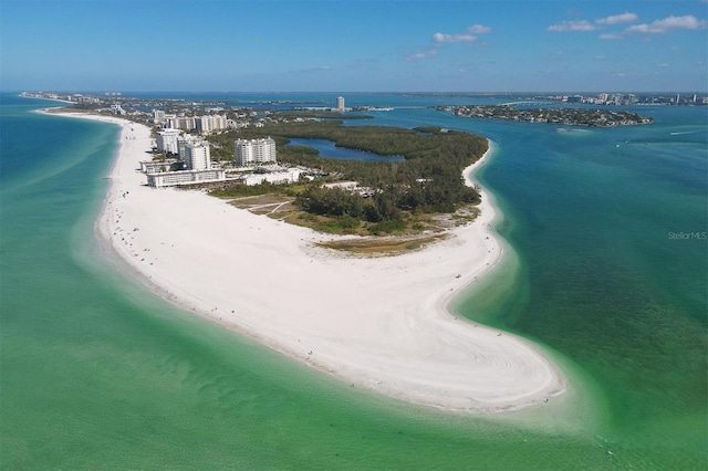 aerial view with a water view and a beach view