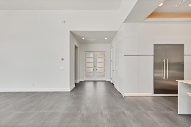 interior space with recessed lighting, baseboards, and french doors