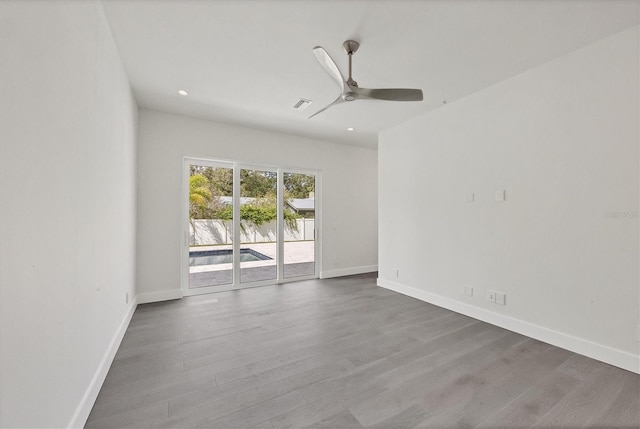 unfurnished room featuring ceiling fan and hardwood / wood-style flooring