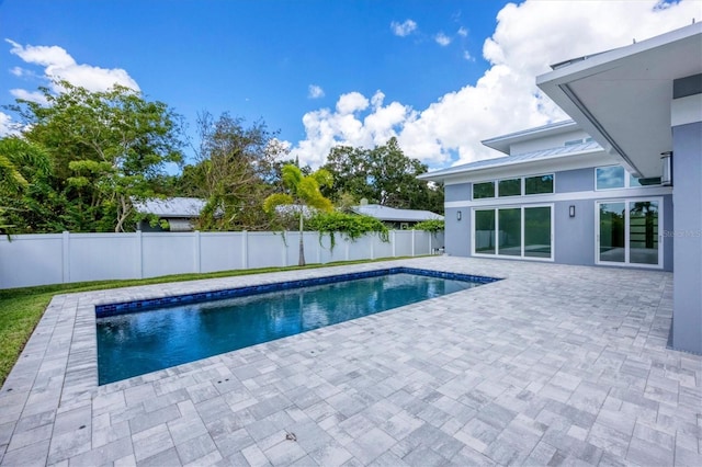 view of swimming pool featuring a patio