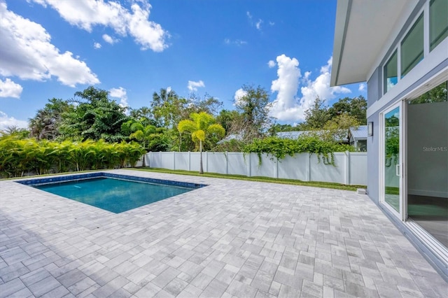 view of swimming pool with a patio