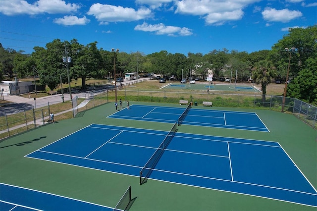 view of sport court with basketball hoop