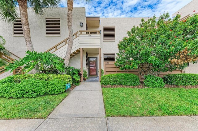 view of front of property with a balcony