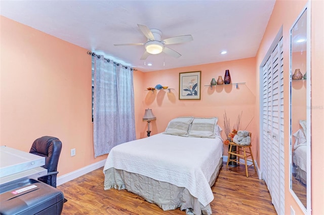 bedroom with hardwood / wood-style floors and ceiling fan