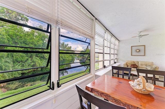 sunroom featuring plenty of natural light and ceiling fan