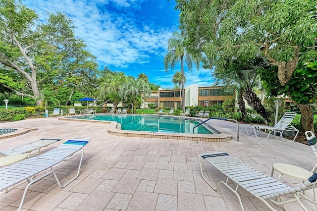 view of swimming pool featuring a patio