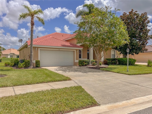 view of front of home featuring a front yard and a garage