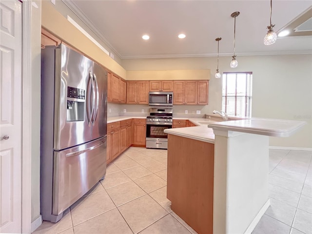 kitchen featuring ornamental molding, a peninsula, appliances with stainless steel finishes, and light countertops