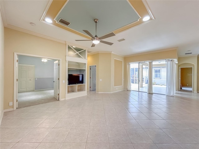 unfurnished living room featuring built in shelves, visible vents, crown molding, and a ceiling fan