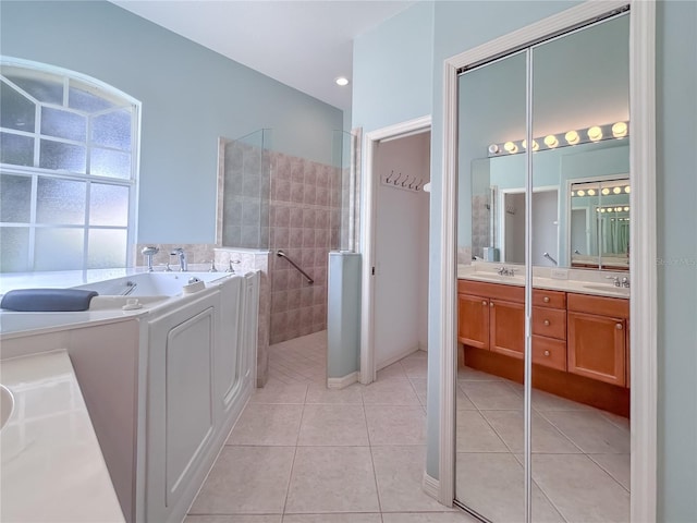 bathroom with a garden tub, double vanity, a sink, tile patterned flooring, and walk in shower