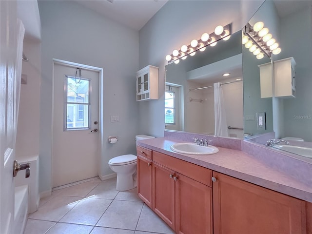 bathroom featuring vanity, tile patterned flooring, and toilet