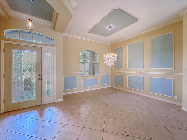 foyer entrance with tile patterned flooring, a notable chandelier, and crown molding