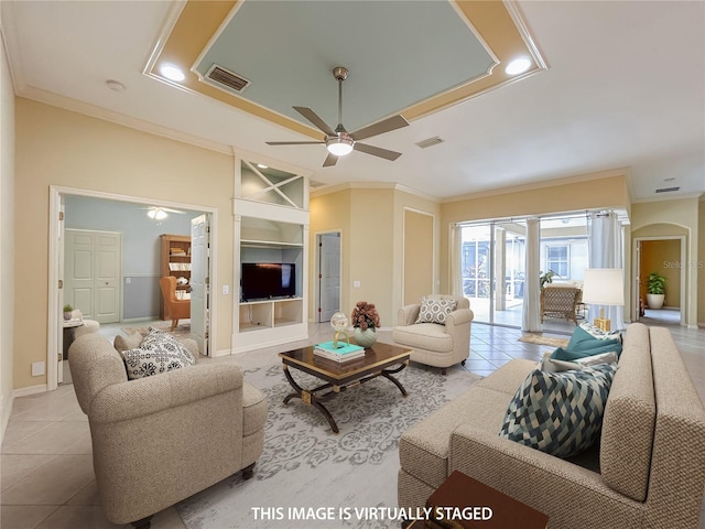 living room with built in features, visible vents, crown molding, and light tile patterned floors