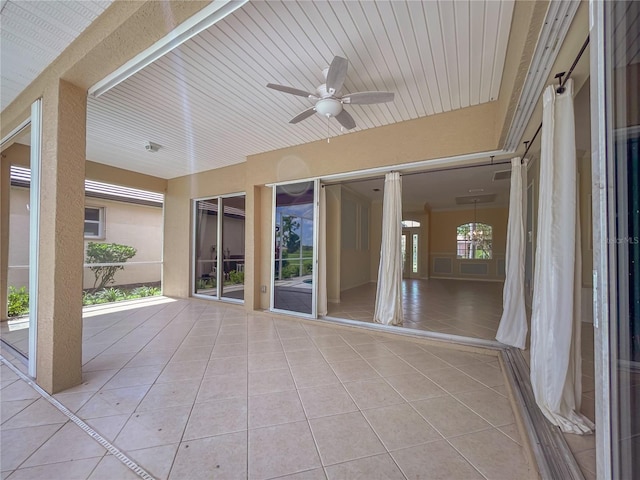 view of patio featuring ceiling fan