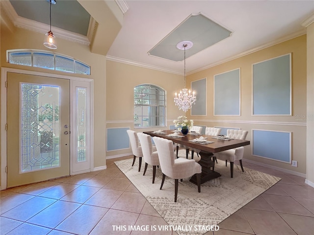 tiled dining space featuring baseboards, ornamental molding, and a notable chandelier