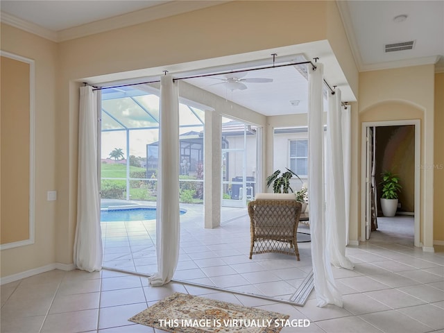 doorway to outside with ornamental molding, visible vents, and light tile patterned floors