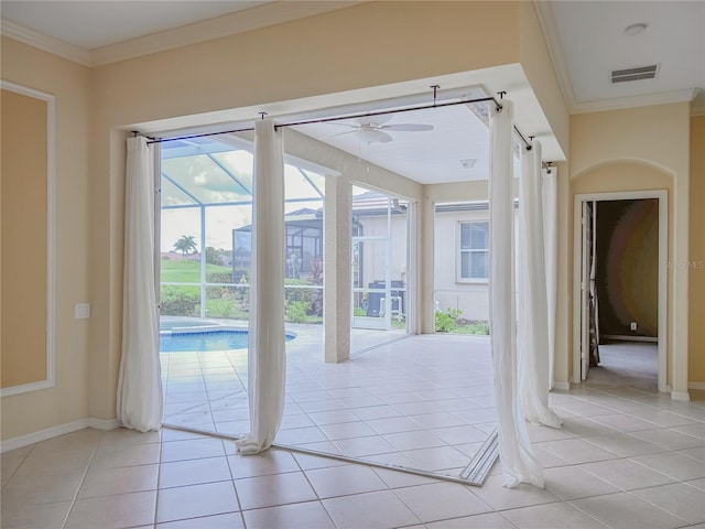 doorway to outside with ornamental molding, light tile patterned flooring, and visible vents