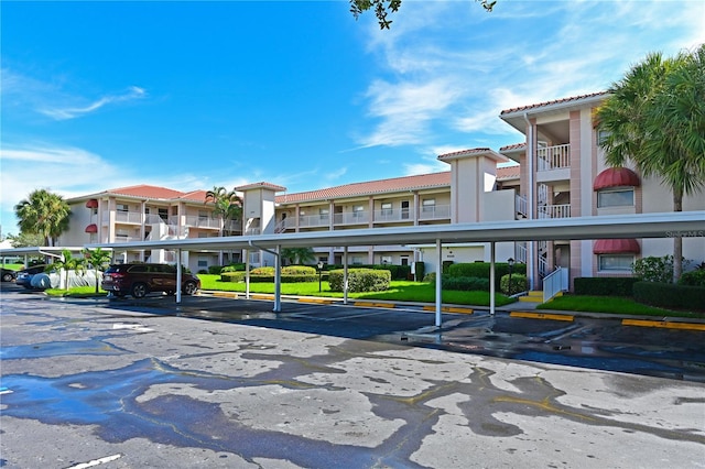 view of property featuring covered parking