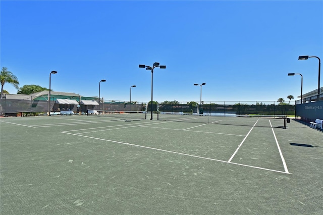 view of tennis court with fence