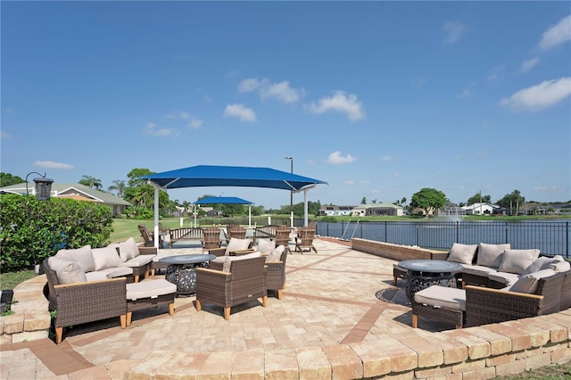 view of patio featuring outdoor dining space, an outdoor living space with a fire pit, and fence