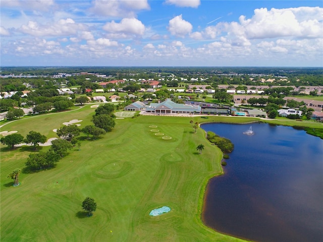 aerial view with golf course view and a water view