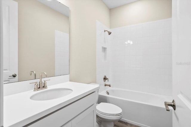 full bathroom featuring toilet, shower / washtub combination, and vanity