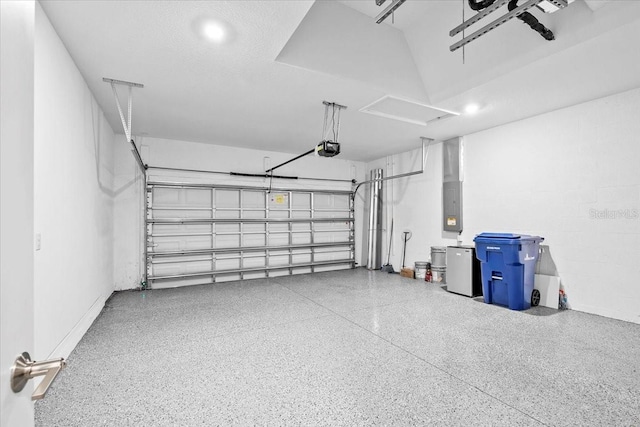 garage featuring electric panel and a garage door opener