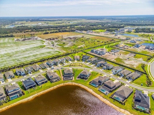 aerial view with a water view and a residential view