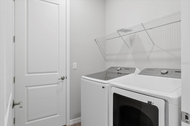 laundry area featuring laundry area and independent washer and dryer