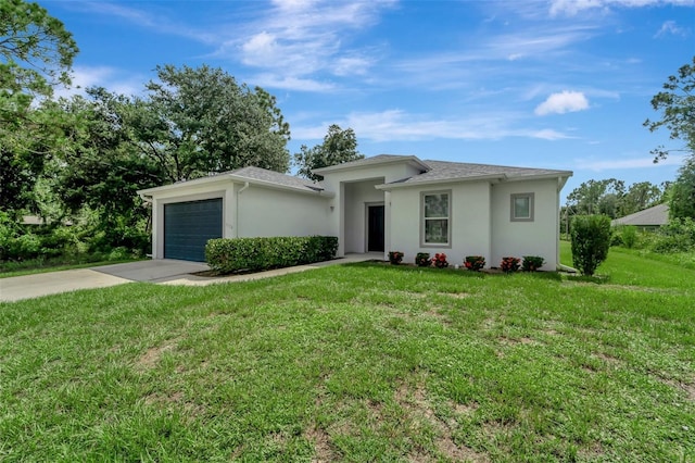 view of front of home with a garage and a front lawn