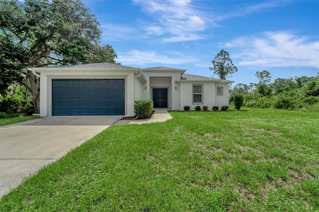 view of front of home featuring a front yard, concrete driveway, an attached garage, and stucco siding