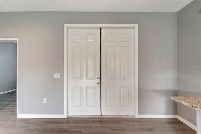 unfurnished bedroom featuring light hardwood / wood-style flooring and a closet