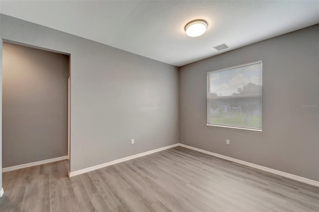 empty room featuring hardwood / wood-style flooring