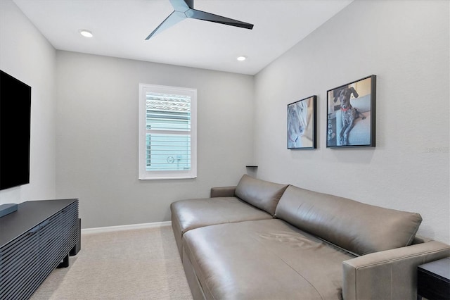 carpeted living room with ceiling fan