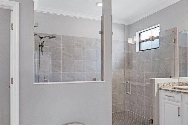 bathroom with vanity, walk in shower, and ornamental molding