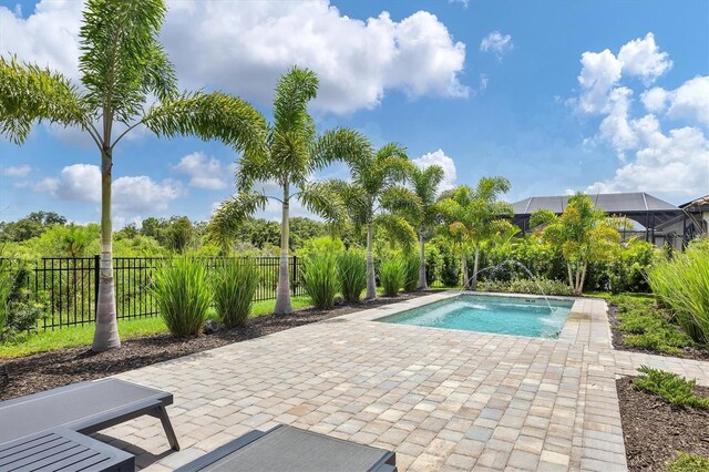 view of pool with a patio area and pool water feature