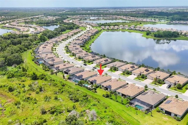 drone / aerial view with a water view