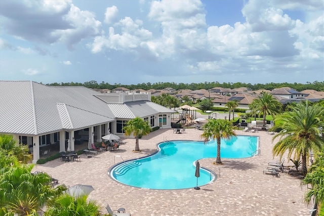 view of swimming pool featuring a patio area