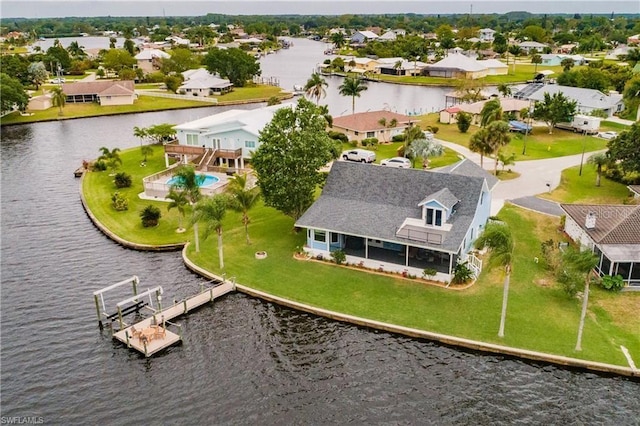 drone / aerial view with a water view