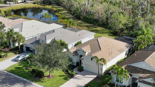 birds eye view of property with a water view