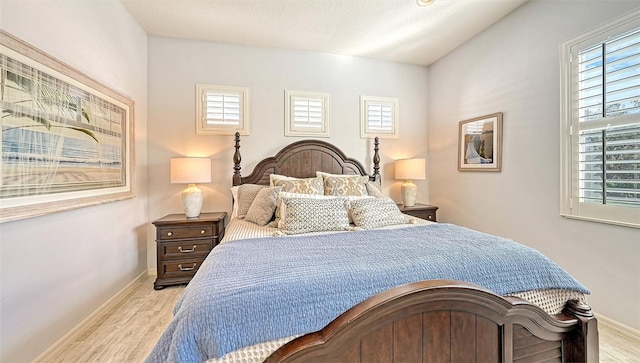 bedroom with light hardwood / wood-style floors