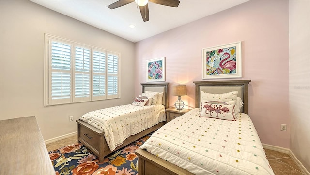 bedroom featuring tile patterned floors and ceiling fan